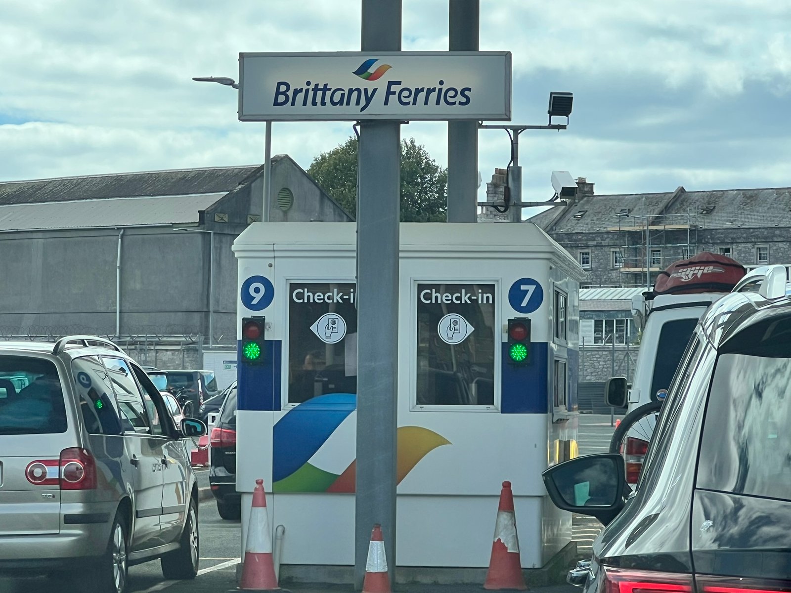 Cars queuing at the Brittany Ferries check-in booths at Plymouth ferry port