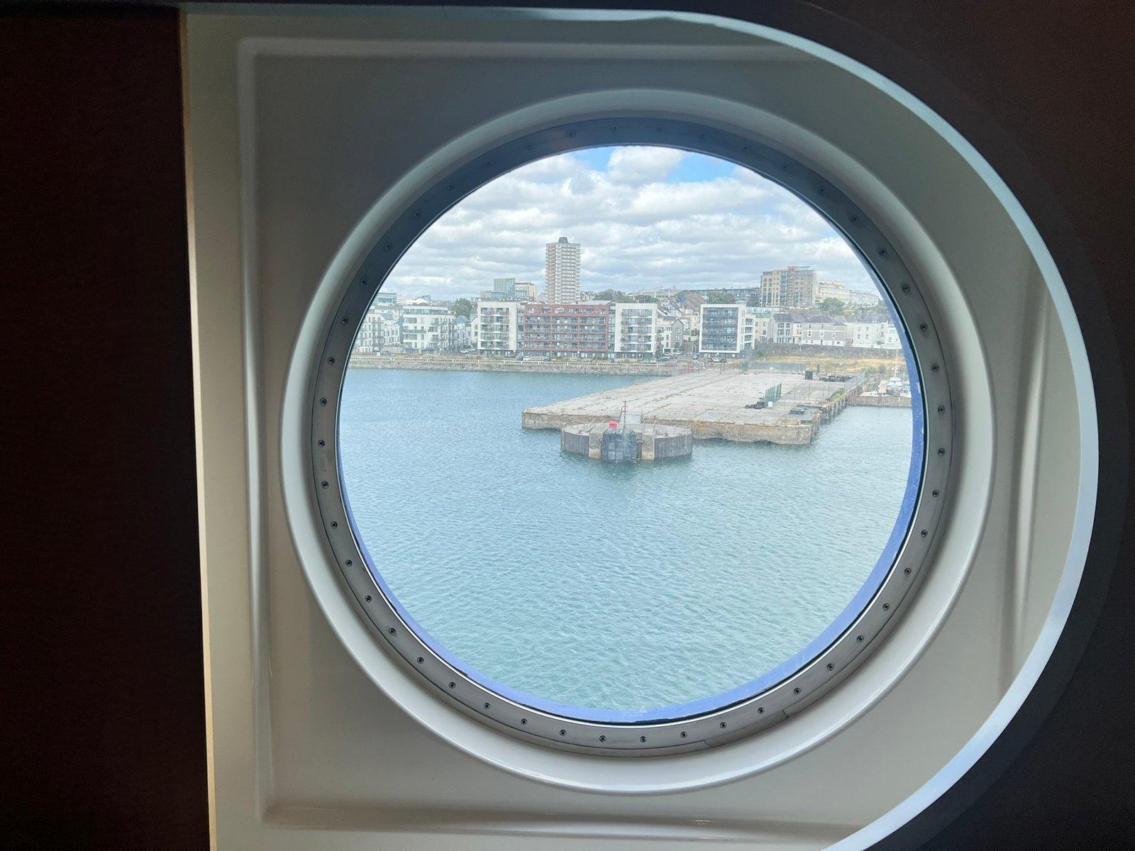 View of Plymouth through a porthole window aboard the Pont-Aven