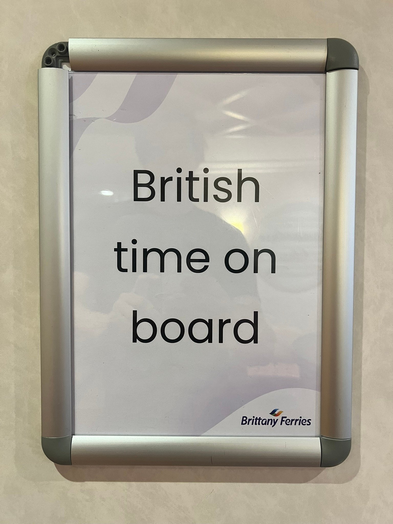 Sign on board the Pont-Aven showing that the ship operates on British time