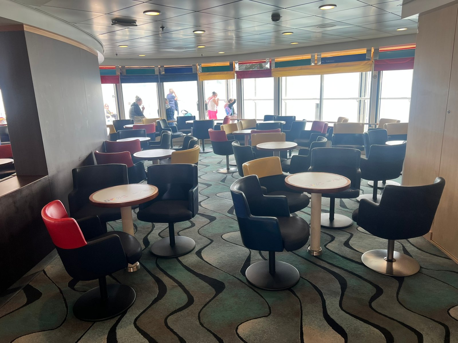Passenger lounge seating beside large windows aboard the Pont-Aven